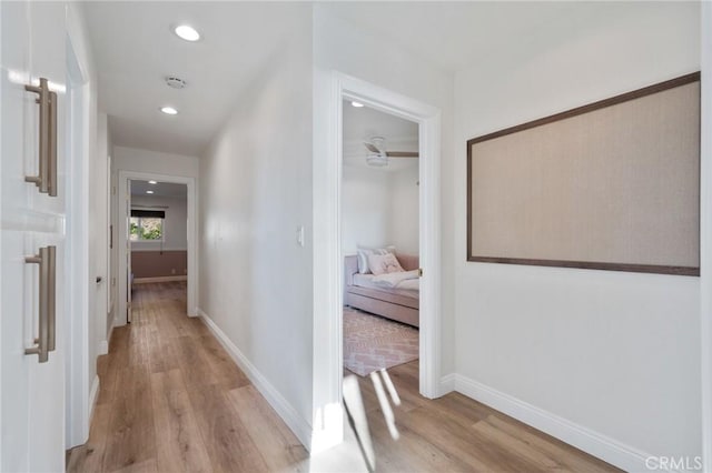 hallway with light wood-type flooring