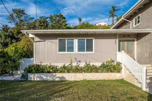 view of property exterior featuring a yard