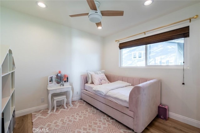 bedroom featuring ceiling fan and light hardwood / wood-style flooring