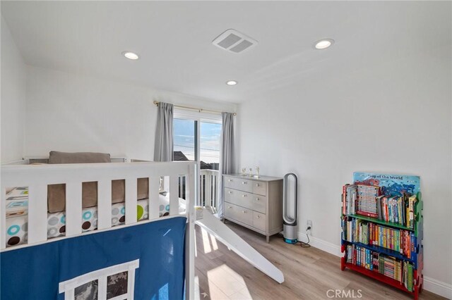 bedroom featuring light wood-type flooring