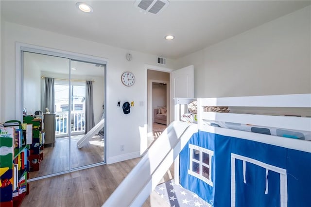 bedroom featuring a closet and wood-type flooring