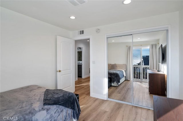 bedroom featuring a closet and light hardwood / wood-style floors