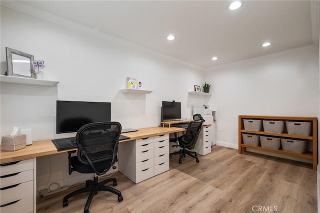 office space with light hardwood / wood-style floors and crown molding