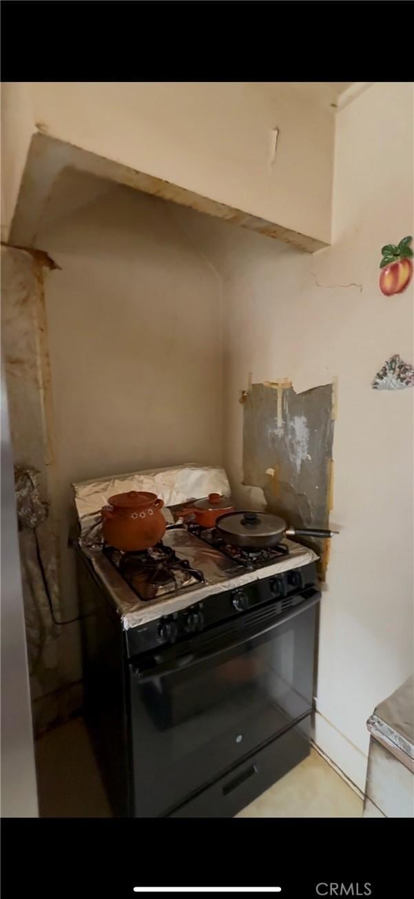 kitchen featuring black gas range oven