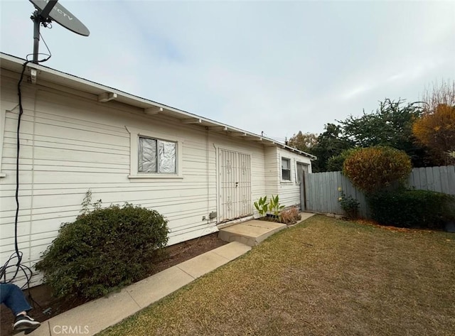 view of home's exterior with a yard