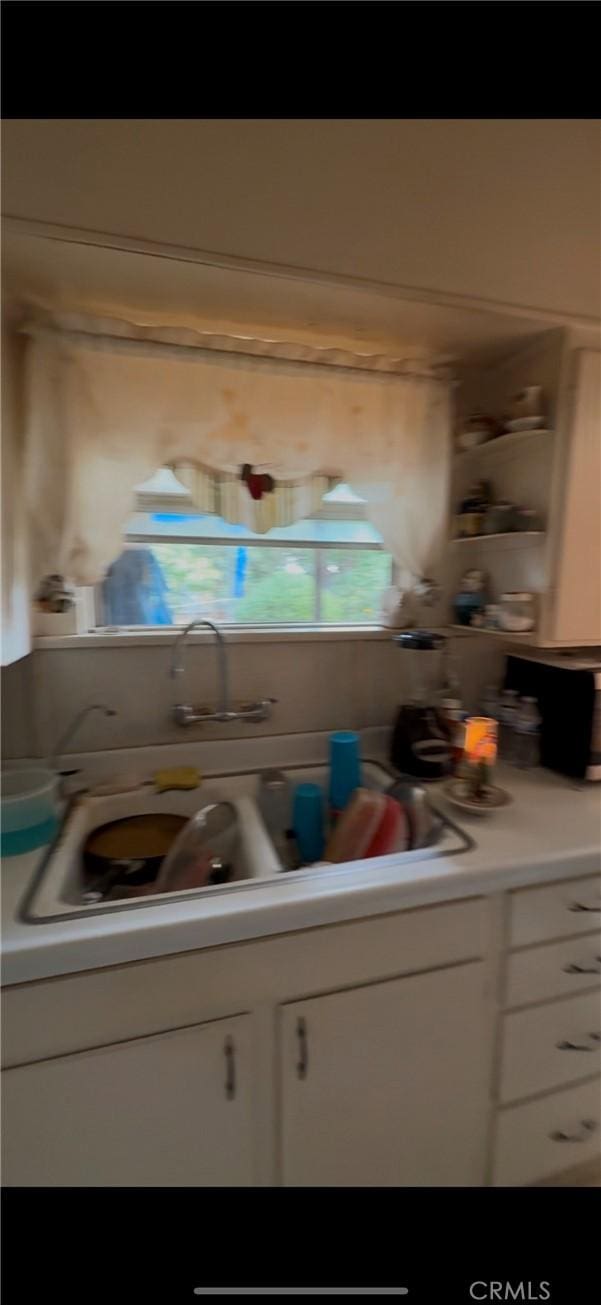 kitchen with white cabinetry