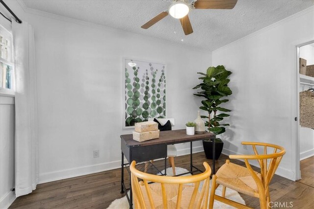 office area featuring a textured ceiling, ceiling fan, ornamental molding, and dark hardwood / wood-style floors