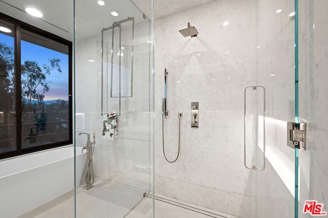 bathroom featuring tile patterned floors, expansive windows, and shower with separate bathtub