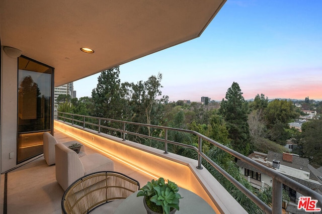 view of balcony at dusk