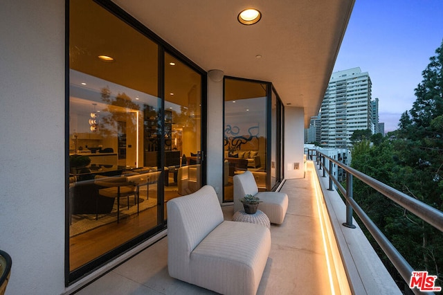 view of balcony at dusk