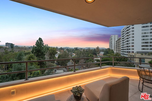 view of balcony at dusk