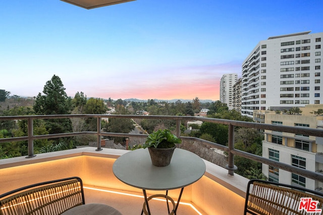 view of balcony at dusk