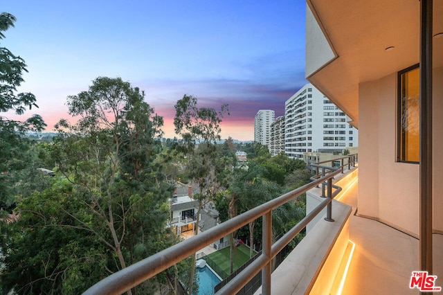 view of balcony at dusk