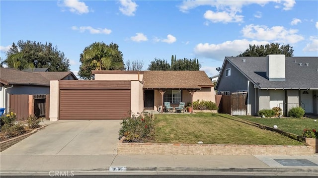 view of front of home with a front lawn and a garage