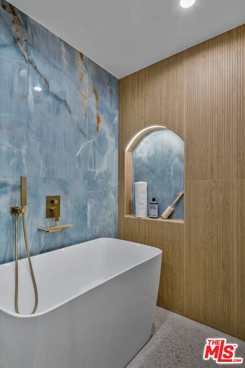 bathroom featuring a tub to relax in