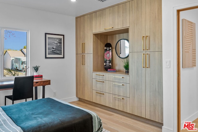 bedroom with light hardwood / wood-style flooring