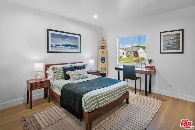 bedroom featuring light hardwood / wood-style flooring