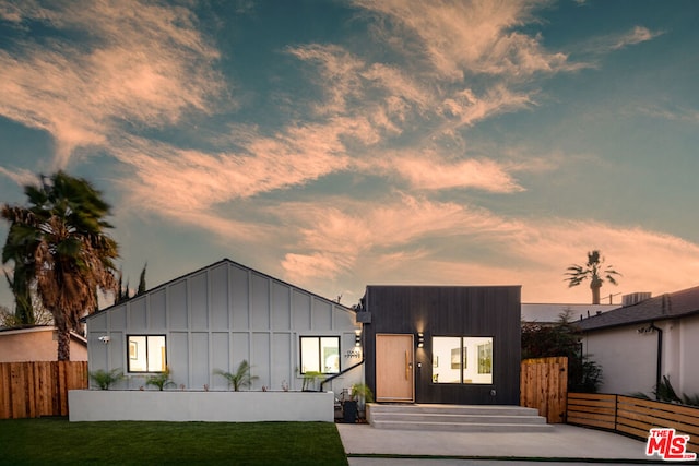 view of front of property with a yard