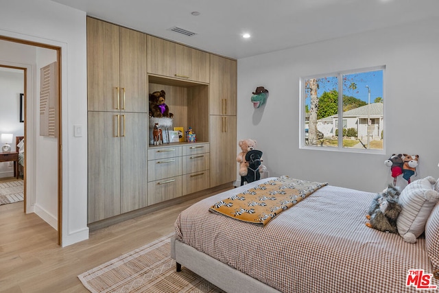 bedroom with light hardwood / wood-style flooring