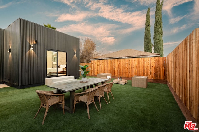 patio terrace at dusk with a yard