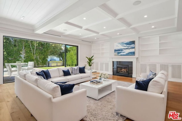 living room featuring a fireplace, light hardwood / wood-style flooring, beam ceiling, and coffered ceiling