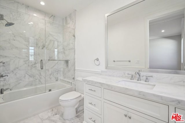 full bathroom with toilet, bath / shower combo with glass door, and vanity