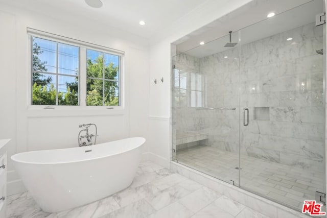 bathroom with separate shower and tub and crown molding