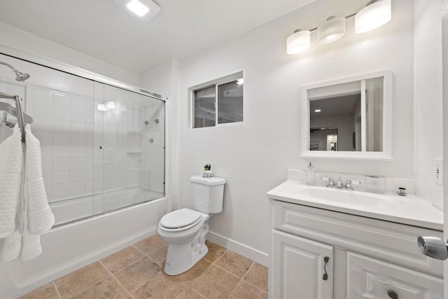 full bathroom featuring toilet, vanity, and shower / bath combination with glass door