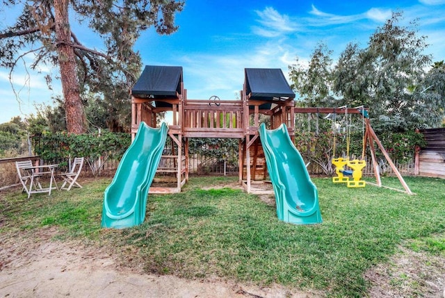 view of playground featuring a lawn