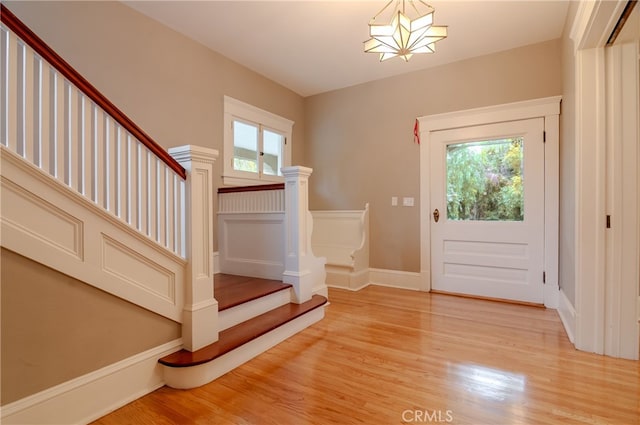 doorway to outside with plenty of natural light and hardwood / wood-style floors