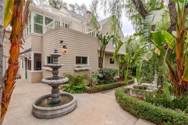 view of property's community with a patio