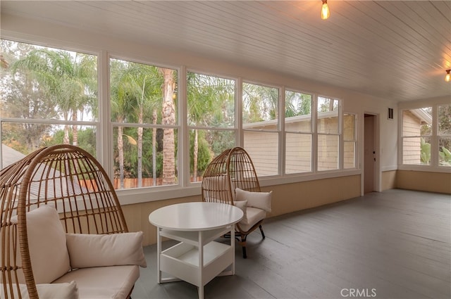 sunroom featuring wood ceiling