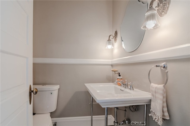 bathroom with toilet and sink