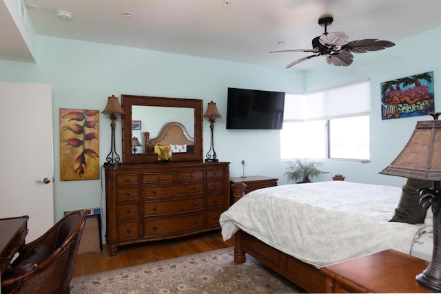 bedroom with ceiling fan and hardwood / wood-style floors