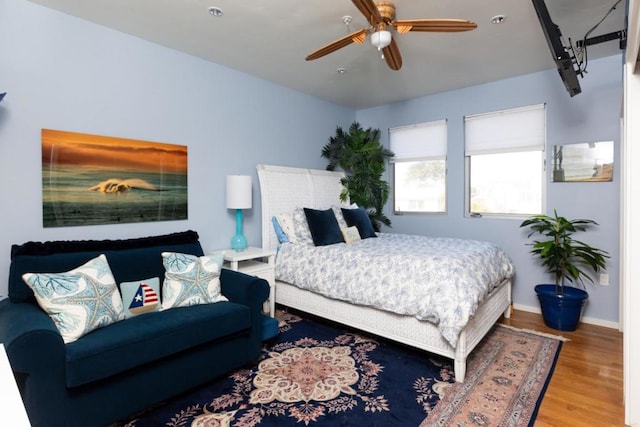 bedroom featuring ceiling fan and wood-type flooring