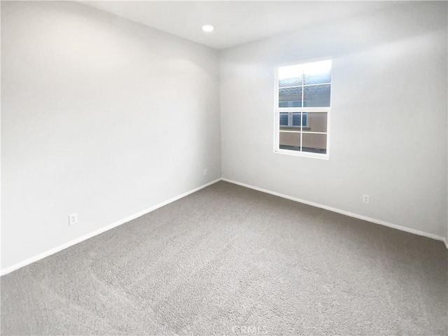 empty room featuring carpet flooring