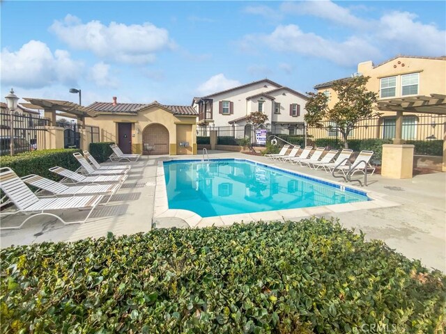 view of pool with a pergola and a patio