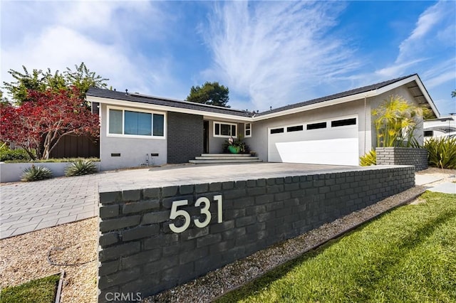 ranch-style home with a garage