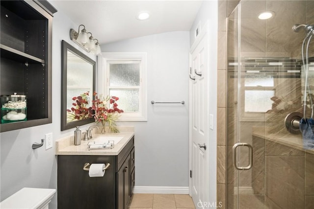 bathroom with vanity, tile patterned flooring, and an enclosed shower