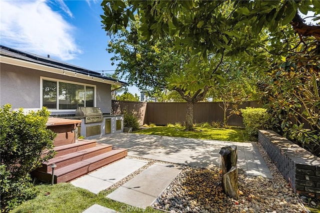 view of patio featuring a grill and exterior kitchen