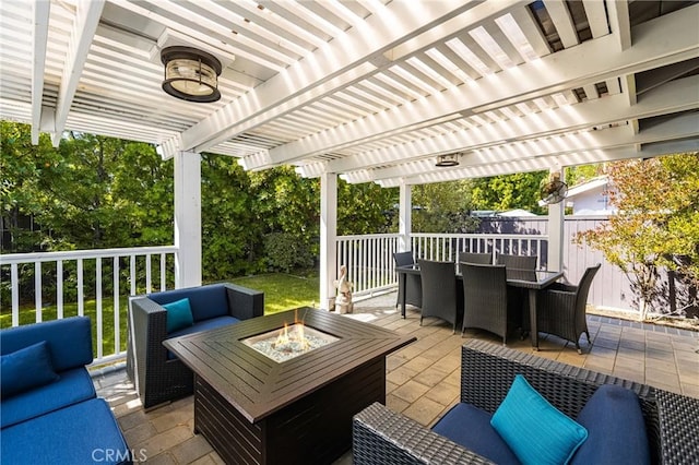 view of patio / terrace featuring an outdoor living space with a fire pit