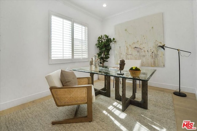 office featuring light hardwood / wood-style floors and crown molding