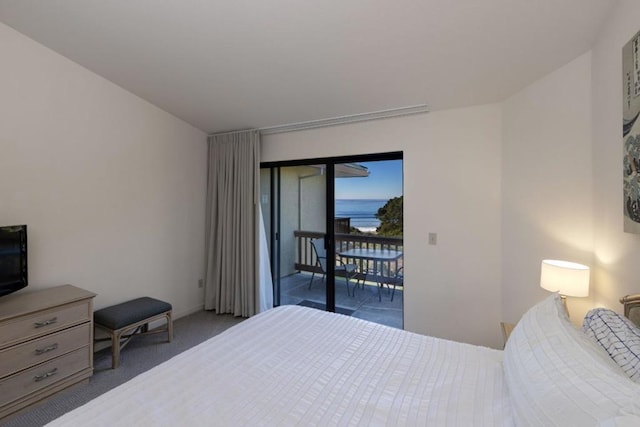 carpeted bedroom featuring access to outside