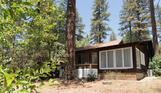 view of side of home featuring a sunroom