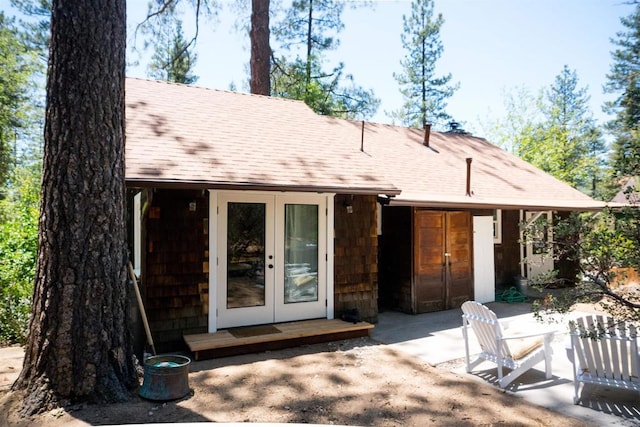 rear view of property with a patio area and french doors