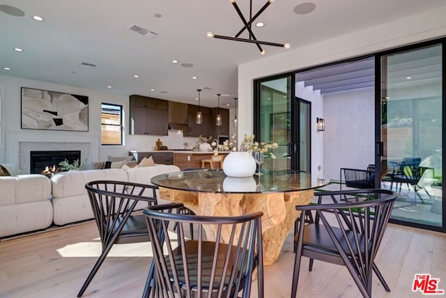 dining room with light hardwood / wood-style floors