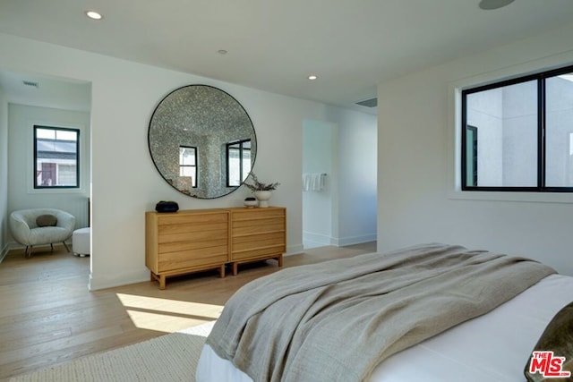 bedroom featuring light hardwood / wood-style floors