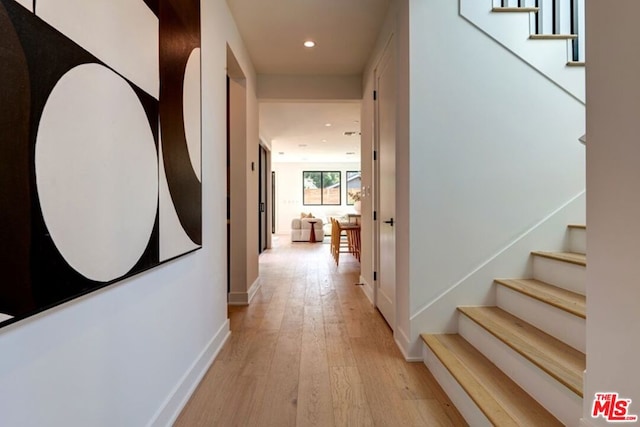 hallway with light wood-type flooring