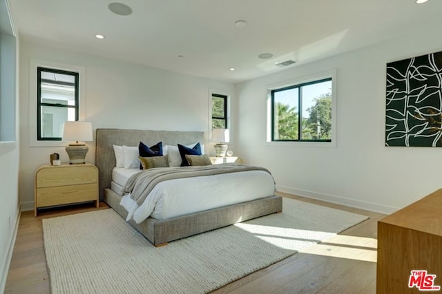 bedroom featuring wood-type flooring