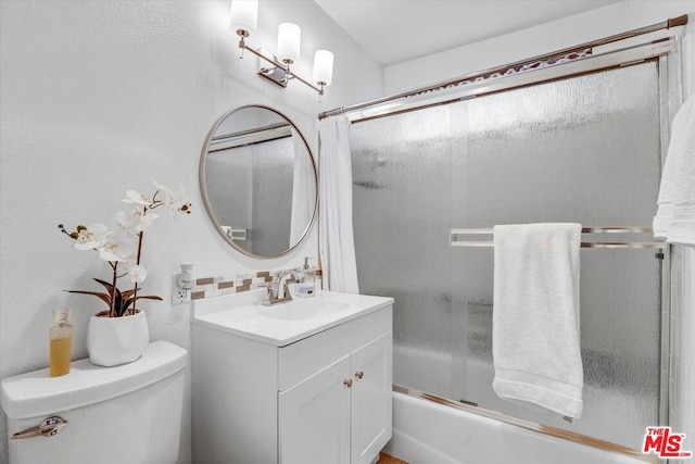 full bathroom with decorative backsplash, enclosed tub / shower combo, vanity, and toilet